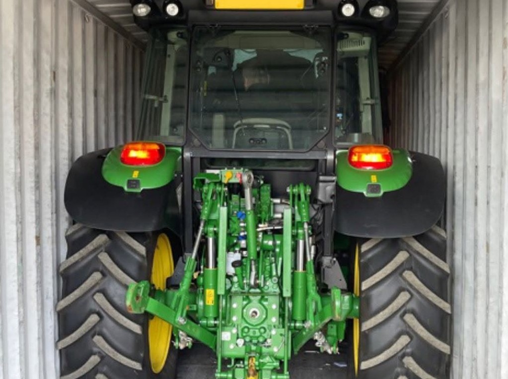 Tractor in container for export